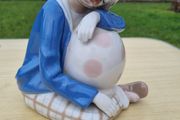 Porcelain sleeping clown with ball