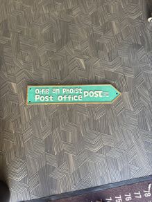 Branded post office sign