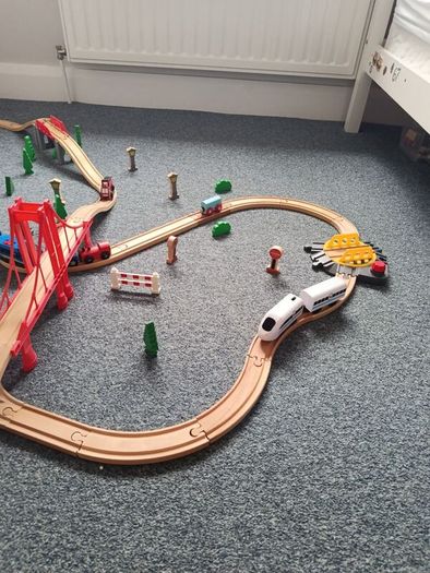 Wooden train set with 5 vehicles and turnstile