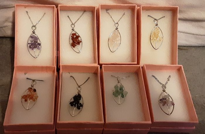 selection of homemade white metal necklaces