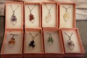 selection of homemade white metal necklaces