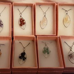 selection of homemade white metal necklaces