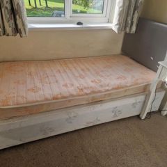 Single bed with grey headboard