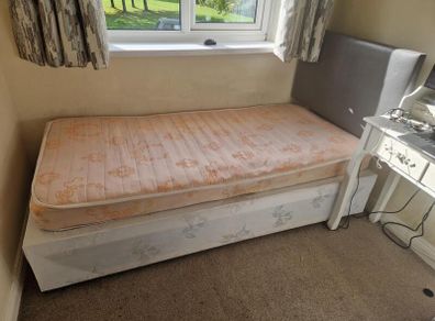 Single bed with grey headboard