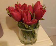Faux pink  tulip posy in glass vase