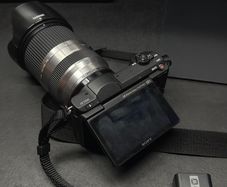 sony a5100 + tamron 18-200 + 2 batteries and 32 gb sd card