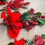 Collection of artificial red poinsettia and berry Image 3