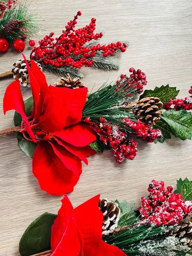 Collection of artificial red poinsettia and berry