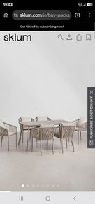 Sklum glass table and four coushioned chairs unwanted gift still in the box