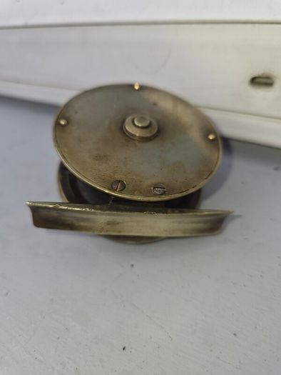 old  brass  fishing real