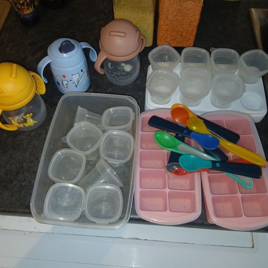 baby containers, spoons and bottles of water