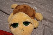 Turtle soft toy with large green eyes