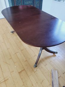 Mahogany dining table with fold-out leaf