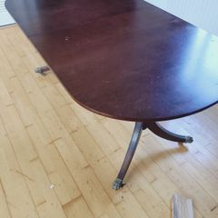 Mahogany dining table with fold-out leaf