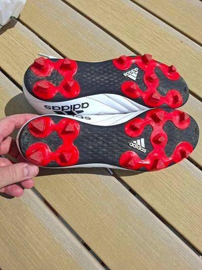 Addidas football boots, shin guards and socks.