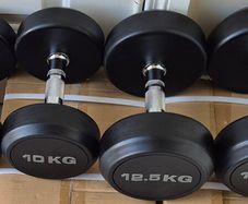 2xbrand new sets of dumbbells 2x12.5kilo, 2x10kilo .