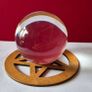 Crystal glass ball on wooden pentagram base. Image 3
