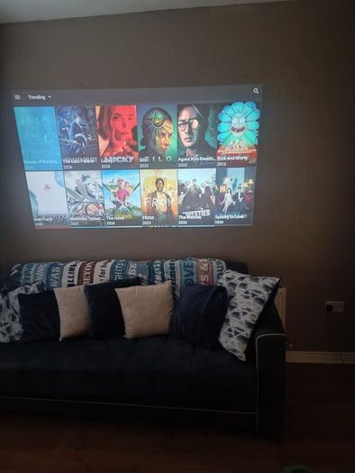 philips neopix ultra 2tv+ home projector and height adjustable stand, built in speakers and android TV with play store stand comes with power point bracket on it as seen in pictures also remote and phone holder