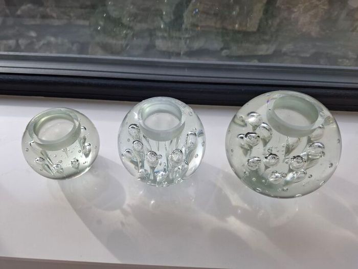 3 x cylindrical glass candle holders.