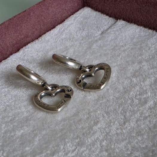 Pandora linked sister hearts split dangle charm. Very good condition hallmarked