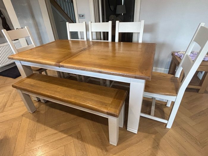 Large extendable 8 seater table with 5 chairs and a bench