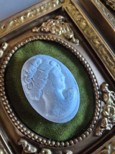 A pair of MidCentury Kelgin wall hanging Plaster  Vintage decorative pair of wall plaques featuring plaster cameos on green velvet background with ornate gold relief plaster frames