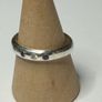 Handmade sterling silver ring with flush set stones. Size O Image 3