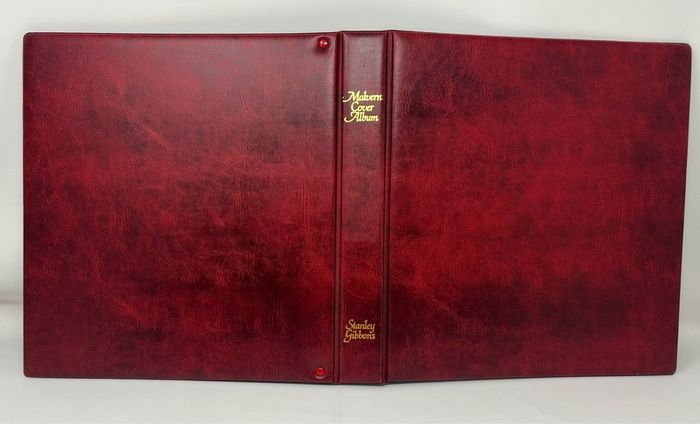 Stanley Gibbons Malvern Wine 4-ring album with 10 first day cover pages.