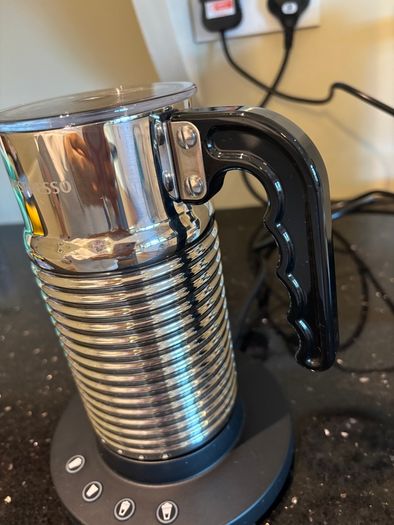 Nespresso espresso machine, milk frother and cups