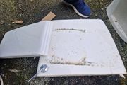 Used ceramic toilet cistern tank
