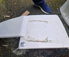 Used ceramic toilet cistern tank