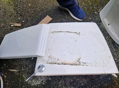 Used ceramic toilet cistern tank
