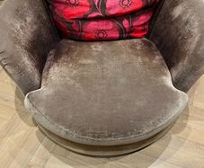 2 brown swivel chairs