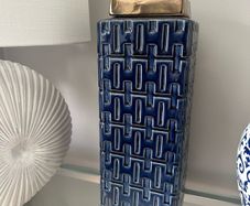 Blue and gold square lidded jar.