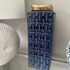 Blue and gold square lidded jar.