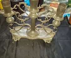 Antique Late 19th early 20th century three light candelabra, with scalloped candle nozzles, scrolling foliate branches and an oval base with chased decoration