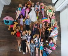 Barbie dolls with babies and dogs