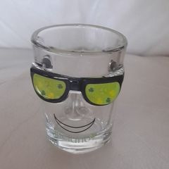Shot glass, face with sun glasses and Ireland written on it