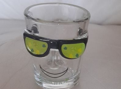 Shot glass, face with sun glasses and Ireland written on it