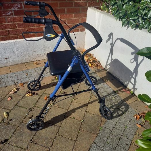 Blue four-wheel rollator with seat and storage bag : BARGAIN
