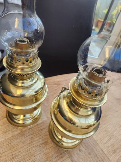 Matching pair of brass oil lamps.