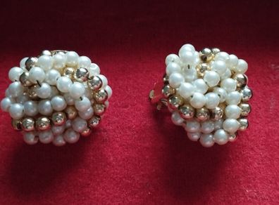 Vintage clip-on earrings with a cluster of faux pearls and gold-tone beads.