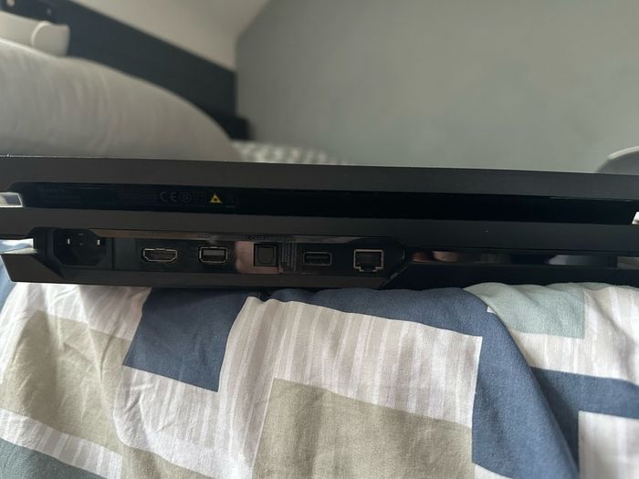 PlayStation 4 Pro 1TB SSD with games, cables and controller