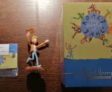 Charlie Bucket Holding Golden Ticket Figurine