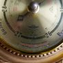 Vintage barometer with silvered dial mounted in an ornate gilt frame. Image 3