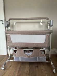 Next to bed baby crib