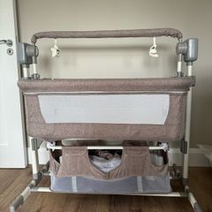 Next to bed baby crib