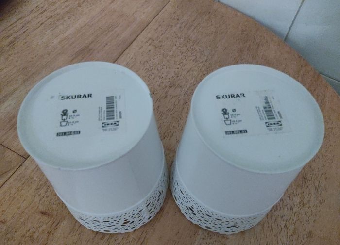 Two metal plantpots / plantpot holders