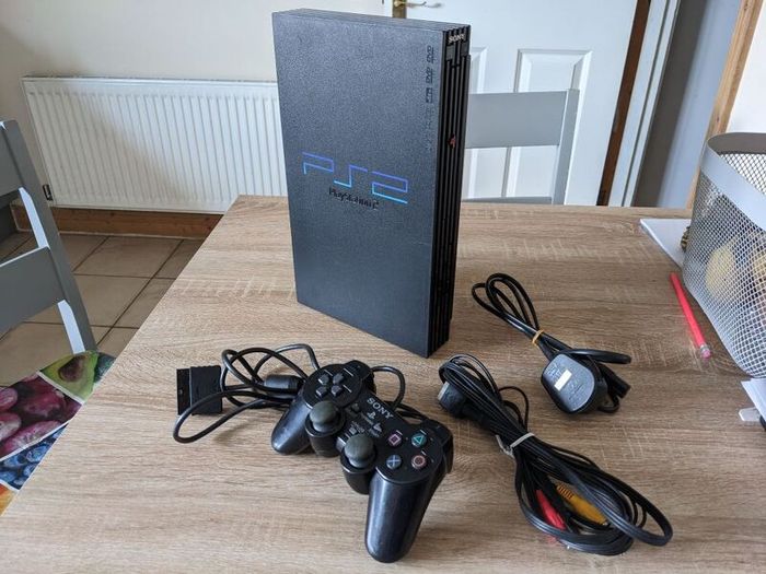 PS2 console with controller and cables