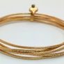 A 14K Yellow Gold Bangle Cluster Bracelet. Image 2